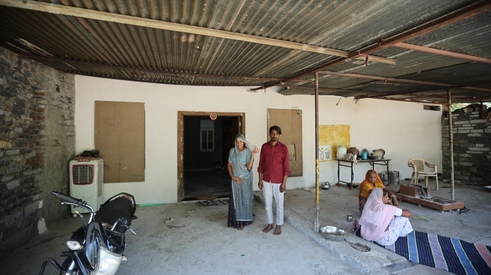 A family on the covered veranda of their home in Rajasthan