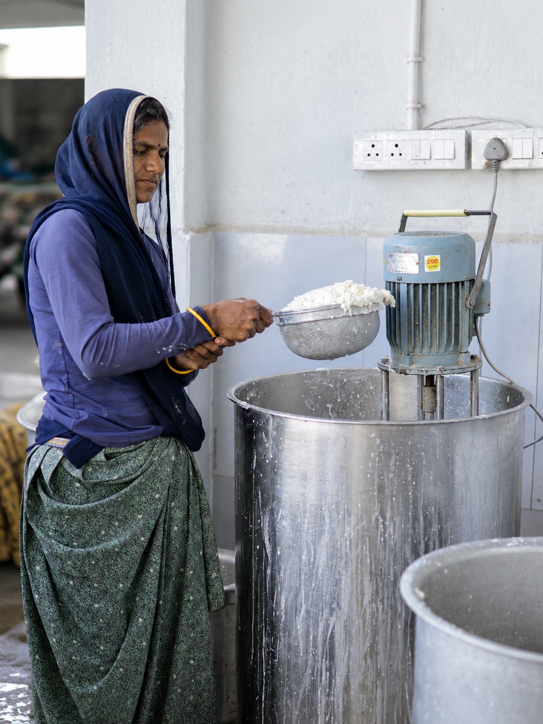 A woman working at a food processing unit
